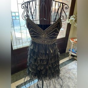 Gorgeous spaghetti strap feathered dress with embellished details
